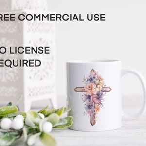 May include: White ceramic mug with a floral cross design. The cross is brown with pink, purple, and yellow flowers. The mug has a handle and is sitting on a white surface. Free commercial use, no license required.