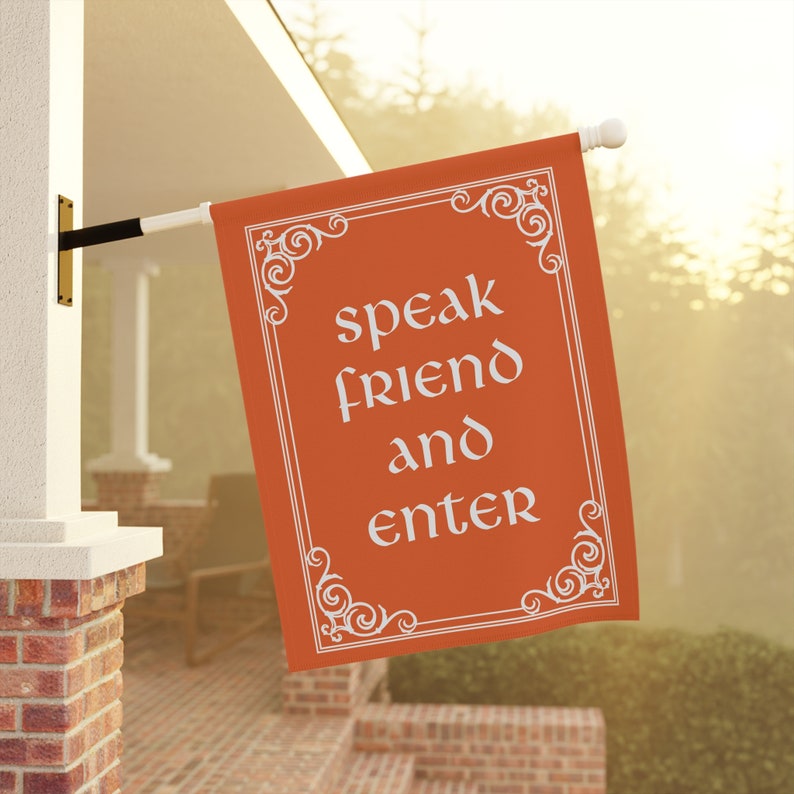 May include: Orange flag with white text and decorative border. The text reads "speak friend and enter".