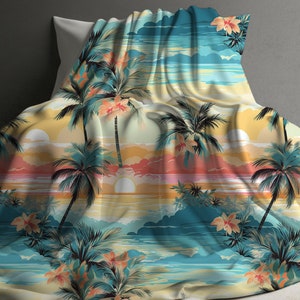 May include: A tropical sunset beach scene with palm trees and flowers printed on a yellow and blue throw blanket.