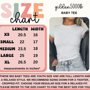 May include: A light gray Gildan 5000B baby tee with a size chart. The chart lists measurements in inches for XS to XL sizes, with lengths from 20.5 to 26.5 inches and widths from 16 to 20 inches. The text recommends sizing down for a tighter fit.