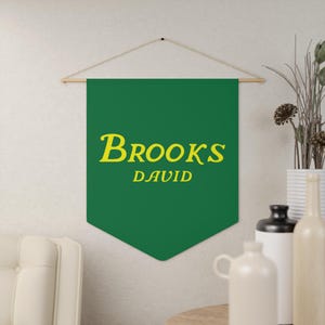 May include: Green fabric banner with the text "BROOKS DAVID" in yellow lettering.