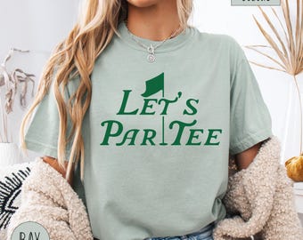May include: A light green t-shirt with the text "Let's ParTee" in green, featuring a golf flag graphic.
