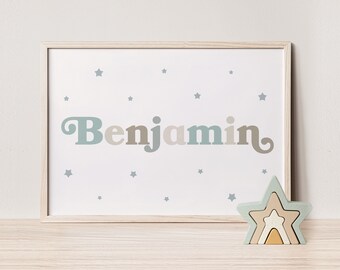 May include: A framed print with the name "Benjamin" in a retro font, surrounded by small blue stars on a white background.