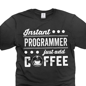 May include: Black t-shirt with white text that reads "Instant...PROGRAMMER just add COFFEE" and a small image of a coffee cup with steam.
