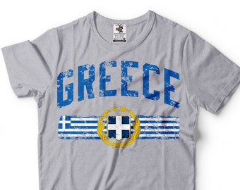May include: A gray t-shirt with a distressed blue and white graphic of the Greek flag and the word "GREECE" in blue.