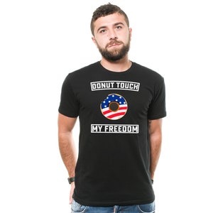 May include: A black t-shirt with a white graphic that says "Donut Touch My Freedom" and features a donut with an American flag design.