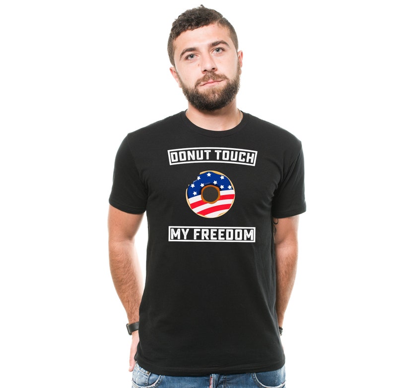 May include: A black t-shirt with a white graphic that says "Donut Touch My Freedom" and features a donut with an American flag design.