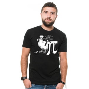 May include: Black t-shirt with a white graphic of a chicken holding a cannabis leaf and the Greek letter pi. The t-shirt is short-sleeved and has a crew neck. The person is wearing a black watch and blue jeans.