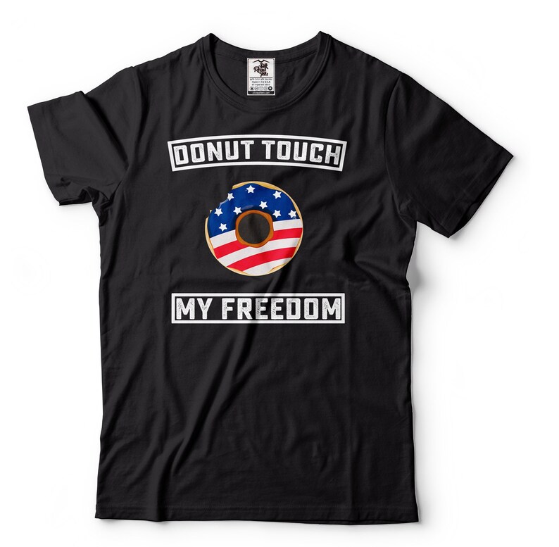 May include: Black t-shirt with a white graphic of a donut with the American flag design. The text "Donut Touch My Freedom" is printed in white on the shirt.