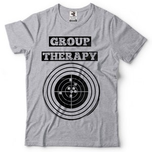 May include: Grey t-shirt with the text "GROUP THERAPY" and a black and white target with bullet holes.