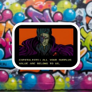 May include: A sticker featuring a retro anime-style character with teal hair and a purple cloak, set against an orange background. The text "CAPITALISTS: ALL YOUR SURPLUS VALUE ARE BELONG TO US." is displayed below the character. The sticker is framed with a white border, set against a graffiti background.