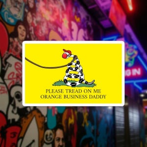 May include: A rectangular sticker with a yellow background features a coiled snake wearing a red hat and holding a leash. The text "PLEASE TREAD ON ME ORANGE BUSINESS DADDY" is below the snake.