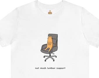 May include: White t-shirt with a cartoon illustration of an orange cat sitting in a gray office chair. The text "not much lumbar support" is printed below the image.