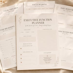 May include: A set of off-white paper planner sheets featuring black text and botanical line art. The central sheet is titled Executive Function Planner, with sections for energy, mental load, daily intentions, priorities, and a gentle reminder.