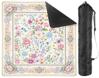 May include: A floral yoga mat with a black carrying bag. The mat features a white background with a colorful array of flowers in pink, blue, purple, and yellow, framed by a decorative border. The black bag has a shoulder strap.