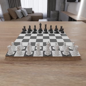 May include: A black and white chess set with a 3D printed design. The chess pieces are arranged on a black and white checkered board. The board is made of wood and has a light brown finish.