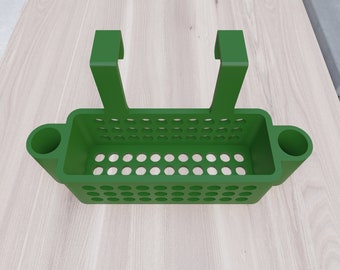 May include: Green plastic hanging shower caddy with two side hooks and two side compartments. The caddy has a rectangular shape with a grid pattern.