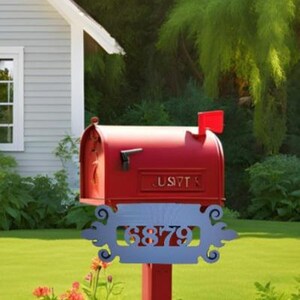 May include: Red mailbox with a white flag and a white sign with the number 6879. The mailbox is mounted on a red post.