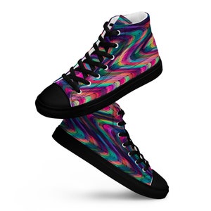 May include: A pair of high-top canvas sneakers with black laces and a black sole. The sneakers have a colorful abstract pattern with shades of pink, blue, green, and purple.