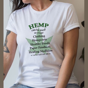May include: White t-shirt with a green hemp leaf graphic and the text "HEMP can be used to create Clothing Hempcrete Healthy Foods Paper Products Healing Medicine w/ no harmful side effects"