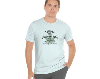 May include: A light blue t-shirt with a green hemp leaf graphic and the text "HEMP can be used to create Biodegradable Plates Water Bottles Paper Products Forks Spoons Knives".