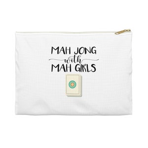 May include: White zippered pouch with the text "Mah Jong with Mah Girls" in black lettering and a white mah jong tile with a green circle and a yellow dot in the center.