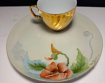 Juego de taza y platillo de té con motivos florales pintados a mano, platos de porcelana firmados por el artista