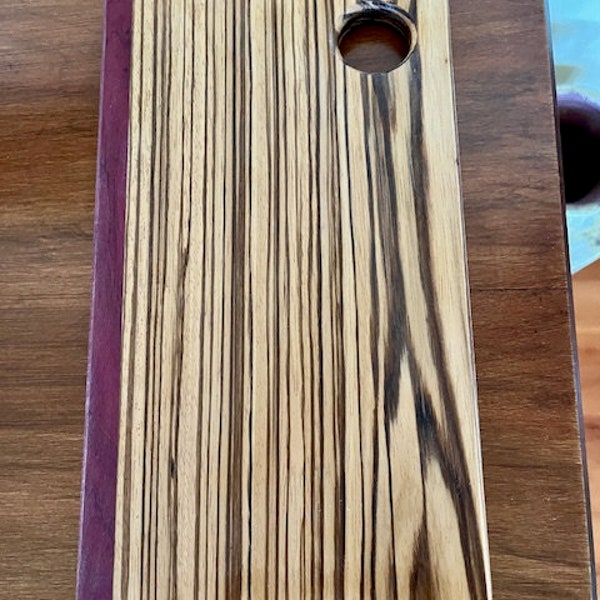 Hand crafted Cutting Board made from Zebra Wood with accent stripe of Purpleheart Beautiful Exotic Wood Board can be personalized