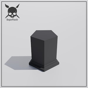 May include: A black hexagonal pedestal with a raised base. The pedestal is made of plastic and has a smooth, matte finish.