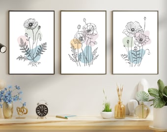Puede incluir: Tres dibujos en blanco y negro de amapolas con formas abstractas de color pastel en el fondo. Los dibujos están enmarcados y colgados en una pared blanca.