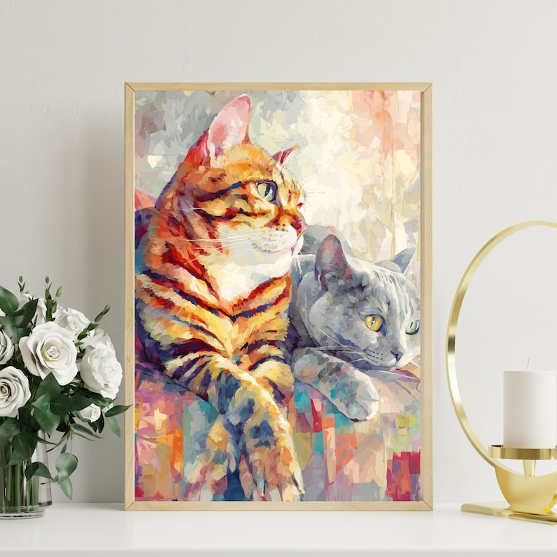 Puede incluir: Una impresi&oacute;n art&iacute;stica enmarcada con dos gatos. Uno tiene rayas naranjas y negras, el otro es gris. La obra de arte tiene un estilo impresionista colorido, con una apariencia suave y texturizada. Los gatos descansan juntos, creando una escena acogedora.