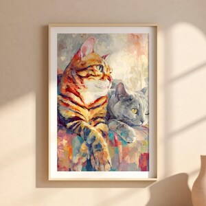 Puede incluir: Una impresi&oacute;n art&iacute;stica enmarcada con dos gatos. Uno tiene rayas naranjas y negras, el otro es gris. La obra de arte tiene un estilo pict&oacute;rico con pinceladas visibles y un fondo abstracto colorido.