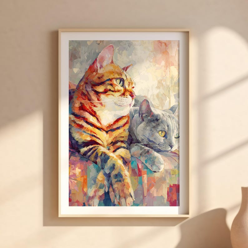 Puede incluir: Una impresi&oacute;n art&iacute;stica enmarcada con dos gatos. Uno tiene rayas naranjas y negras, el otro es gris. La obra de arte tiene un estilo pict&oacute;rico con pinceladas visibles y un fondo abstracto colorido.