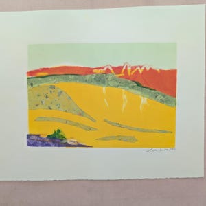 May include: A colorful abstract landscape print with a yellow foreground, a green middle ground, and a red and white background. The print is signed "Lisa Smith 2007".