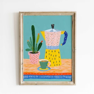 May include: A framed art print depicting a still life with a yellow coffee maker, a green coffee cup, and a potted cactus. The coffee maker has pink and yellow details. The background is a light blue colour.