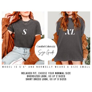 May include: Two models wearing black t-shirts with white letters. The model on the left is wearing a size "S" and the model on the right is wearing a size "XL". The text "Comfort Colors 1717 Size Guide" is in a circle on the image. The text "MODEL IS 5'4" AND NORMALLY WEARS A SIZE SMALL" is below the models. The text "RELAXED FIT, CHOOSE YOUR NORMAL SIZE OVERSIZED LOOK, GO UP 2 SIZES SHIRT DRESS LOOK, GO UP 3 SIZES" is below the text about the model.