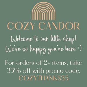 May include: A green background with a rainbow graphic and the text "COZY CANDOR" in white. The text "Welcome to our little shop! We're so happy you're here :)" is also in white. The text "For orders of 2+ items, take 35% off with promo code: COZYTHANKS35" is in white.