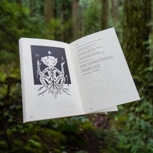 May include: A black and white illustration of a person sitting with their legs crossed. The person has roots growing from their body and is holding a flower. The text on the page reads "Life grows into the air, my proportions to my standards, I bow to the ground. I measure my boundaries by the earth I walk and feel my deepening rapport with each step. I count the myth to which every day-dreaming of rest and rebirth can lead from here. We speak the same words that come to be yours. We keep that time open. We protect it from engulfment and from being broken, not letting it descend into the oblivion like a falling balloon. This time connects us to the stars, to the ground, and to each other. It is our pact. It is our midline."