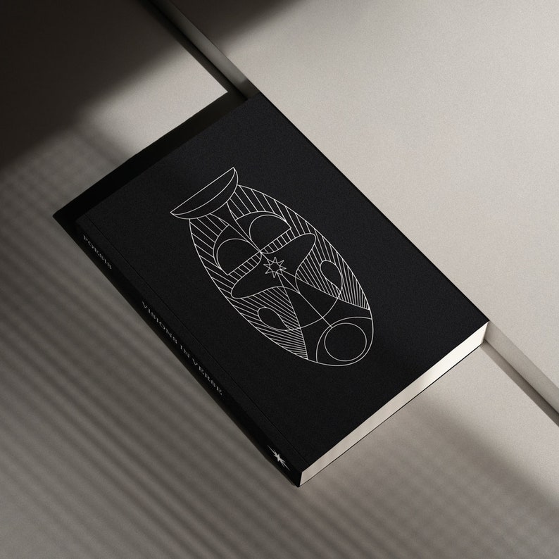 May include: A black hardcover book with a white geometric design on the cover. The title "VISIONS IN THE DARK" is printed on the spine.