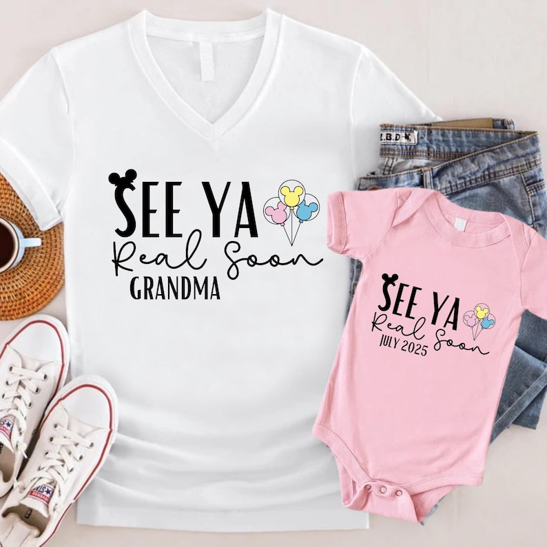 May include: A white t-shirt with a black Mickey Mouse head and the text "See Ya Real Soon Grandma". A pink baby onesie with the text "See Ya Real Soon July 2025" and a Mickey Mouse head.