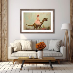 May include: A framed illustration of a woman in a pink dress riding a green dinosaur. The woman is wearing a pink flower in her hair and holding a book. The background is a light blue sky with clouds.