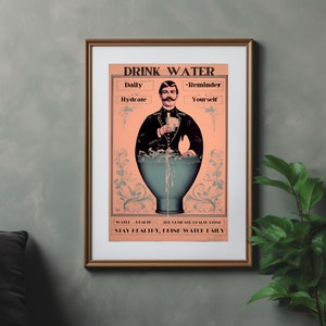 May include: A vintage-style poster with a peach background and ornate floral borders. The poster features a man in a black suit and a mustache holding a cup of water. The text on the poster reads "Drink Water - Daily Hydrate - Reminder Yourself - Water = Health - The Ultimate Health Drink - Stay Healthy, Drink Water Daily".