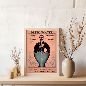 May include: A vintage-style poster with a man in a suit holding a glass of water. The poster says "Drink Water" and has the text "Daily Hydrate" and "Reminder Yourself". The poster also says "Water Health, The Climate Health, Stay Healthy, Drink Water Daily".