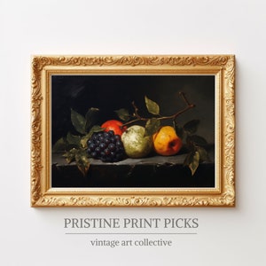 May include: A framed still life painting featuring a cluster of dark grapes, a red apple, and two pears in shades of green and yellow. The artwork is set against a dark background and framed in a gold ornate frame. The text "PRISTINE PRINT PICKS" and "vintage art collective" are at the bottom.