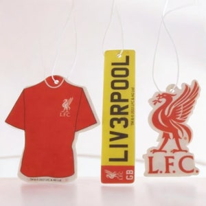 May include: Three car air fresheners featuring the Liverpool Football Club logo. The first is a red t-shirt with the LFC logo. The second is a yellow rectangle with the text "LIV3RPOOL" and the LFC logo. The third is a white bird with the LFC logo and the text "L.F.C."
