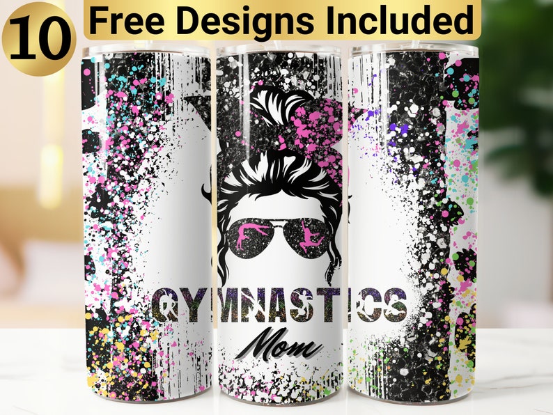 May include: A white tumbler with a black and white graphic of a woman with a messy bun and sunglasses. The graphic also includes the words "Gymnastics Mom" and a colorful splatter paint design.