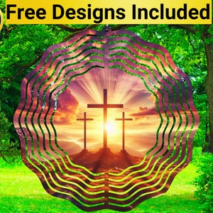 May include: A metal wind spinner with a circular design featuring three crosses silhouetted against a sunset. The crosses are positioned in a row, with the center cross being the largest. The background is a vibrant sunset with rays of light emanating from behind the crosses. The wind spinner is surrounded by a series of concentric circles, creating a swirling effect.
