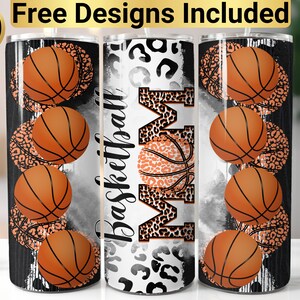 May include: Three stainless steel tumblers with a basketball and leopard print design. The tumblers have a black and white background with the word "Basketball Mom" printed on the middle tumbler.