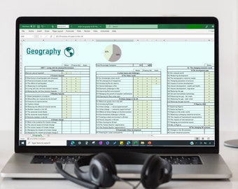 May include: A laptop displaying a spreadsheet titled "Geography" with various topics and data. The screen shows a pie chart and a table with rows and columns. Black headphones rest in front of the laptop.