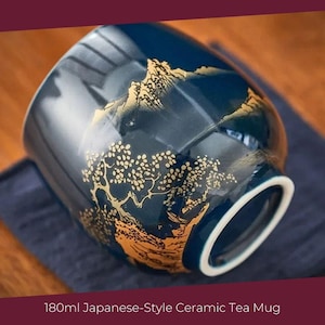 May include: A blue ceramic tea mug with a gold mountain and tree design. The mug is 180ml.